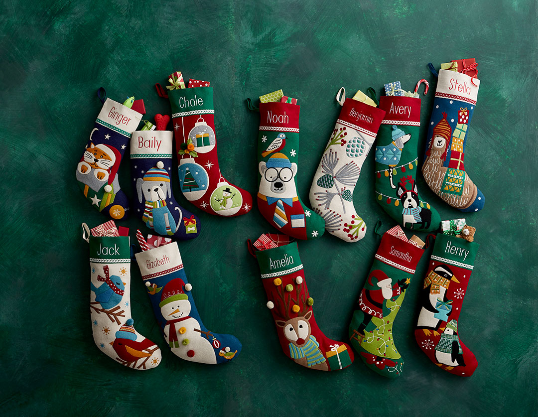 A collection of wool appliqué stockings by The Company Store