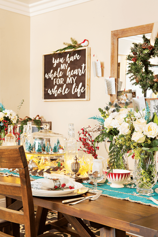 Vibrant aqua and pops of Rudolph-red give the table setting a merry and bright feel.