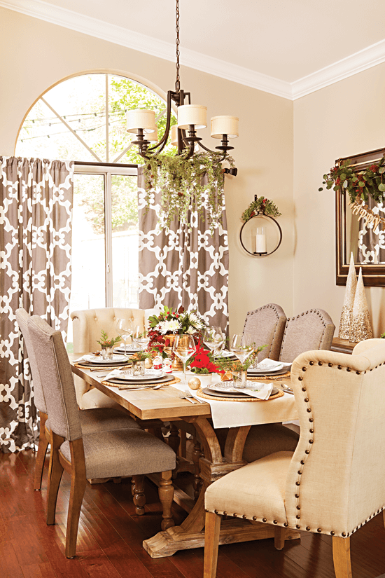 This elegant dining room is decorated with accents of red and green. The overall room décor is simple, which draws the eye towards the detailed dining table. // Cottages & Bungalows