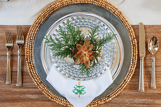 Holiday place setting created by adorning vintage napkins with succulents. // Cottages & Bungalows