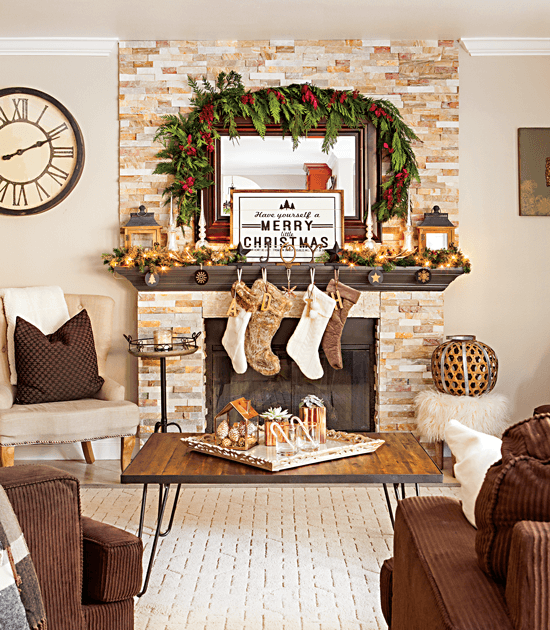 This farmhouse-style Christmas mantel is decorated with simple greenery, wood ornaments, deer antlers and neutral colors for a warm and inviting look. // Cottages & Bungalows