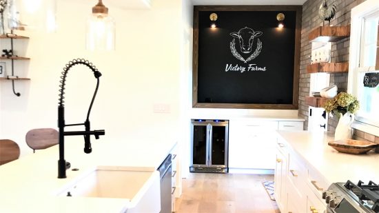 Quartz countertops and a farmhouse-style sink were installed in the kitchen to give it a modern farmhouse vibe.