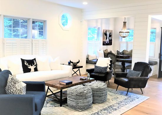 Open-concept living and dining area featuring a blue and white color palette.