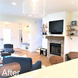 fireplace with brick facade and reclaimed mantel