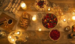 candlit christmas dessert table