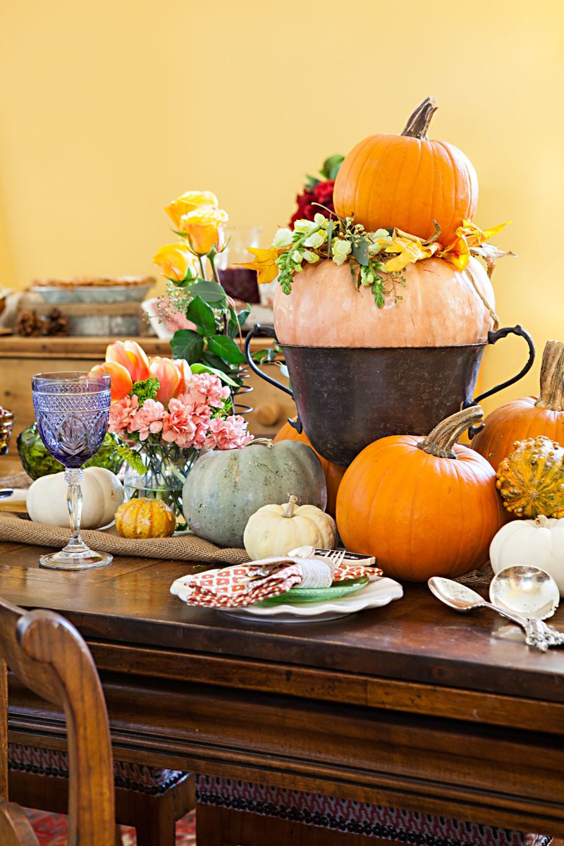 thanksgiving pumpkins in a vintage urn