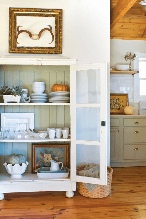 In an older kitchen that doesn’t offer a lot of storage, a cabinet like this can serve as additional storage for dishes as well as serve as a conversation piece.