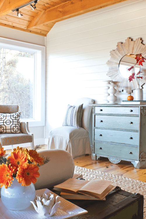 The sofa was a treasure found at a garage sale or just $10. A fresh white slipcover gives it a bright look to serve as the anchor of the living room.