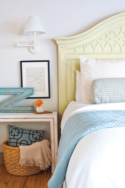 white and blue color pairings give the master bedroom and fresh and airy look