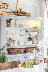 Christmas kitchen decor displayed in a hutch - open shelving