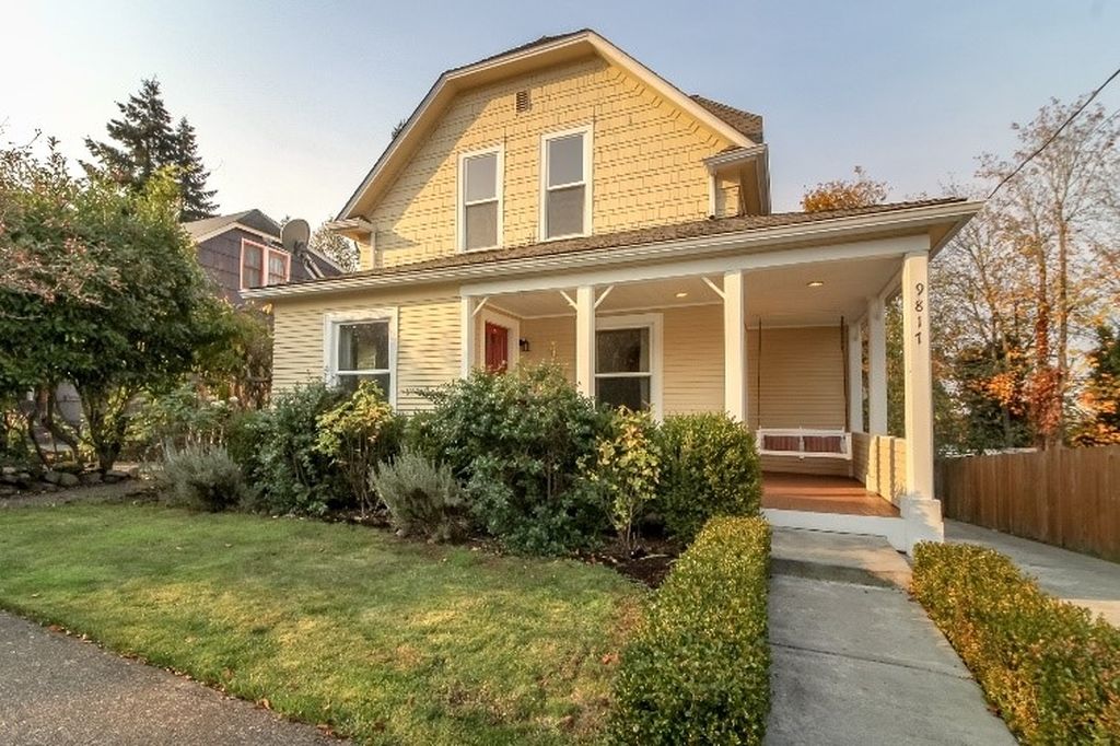 yellow farmhouse cottage seattle