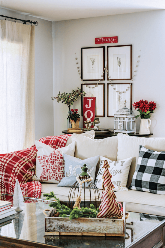 sofa with holiday pillows and decor