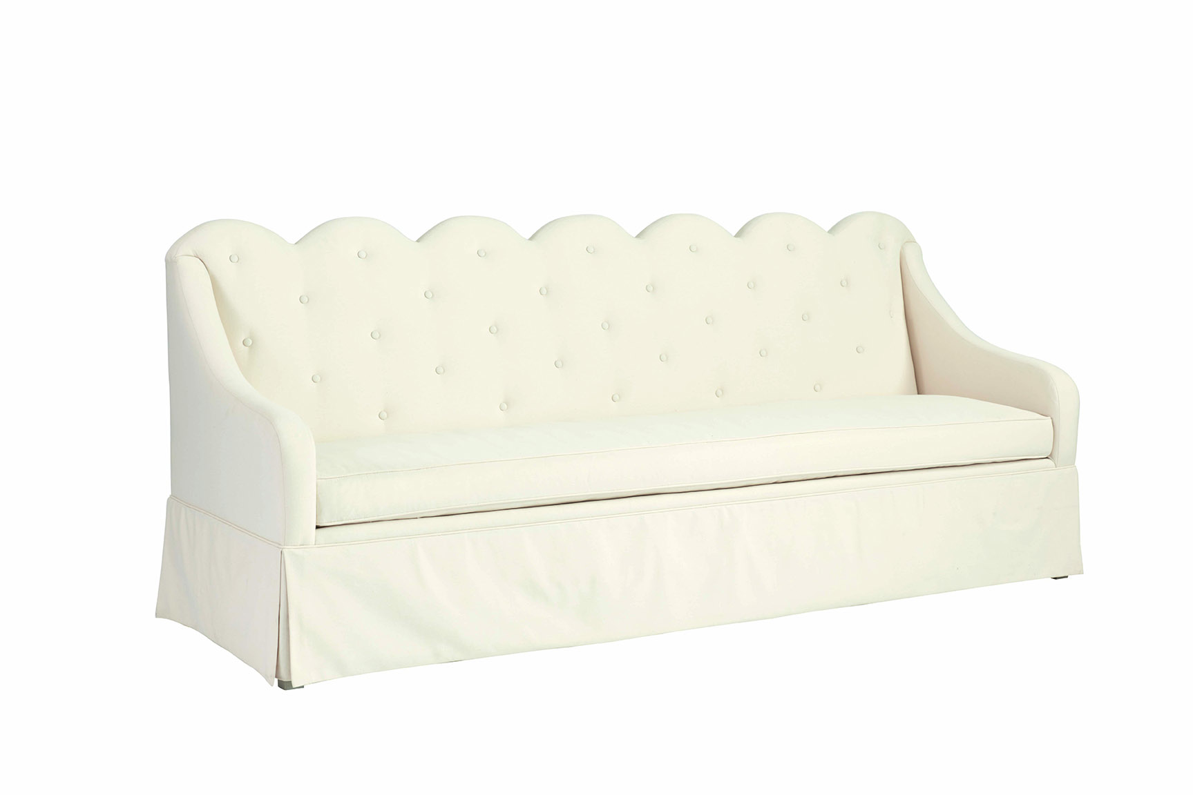 Unique scallop-back tufted cottage sofa.