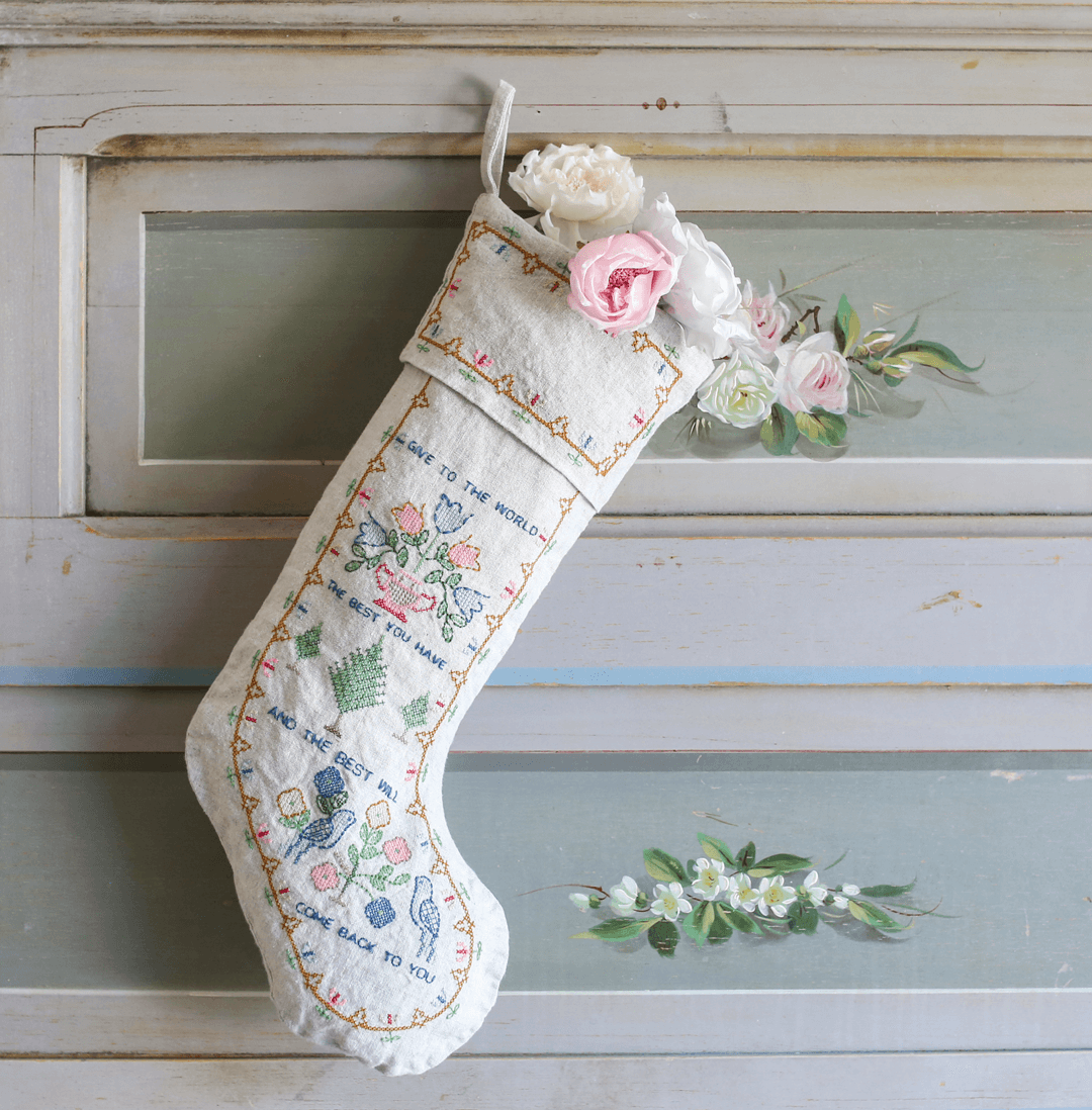 This Shabby Chic Christmas stocking references antique embroidery samplers that feature the tiny stitches, folk patterns and wise sayings. 