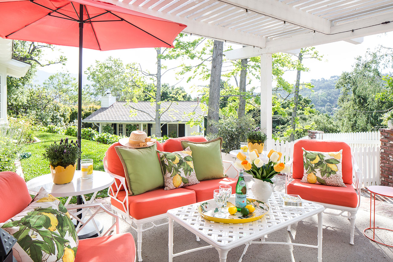 Living Coral patio furniture in a cottage garden