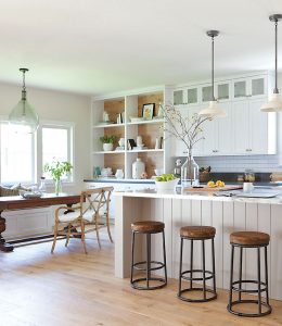 A simple cottage kitchen with open shelves.