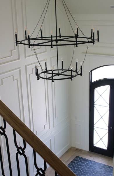 This chandelier, from Capital’s Lancaster Collection, works perfectly here with the higher ceiling and wainscoting on the walls, creating a focal point.