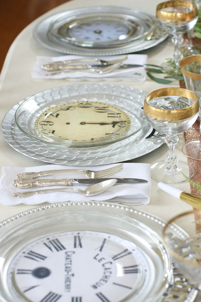 Don’t be afraid to mix and match plates, glasses and other tableware for your New Year's Eve table decor. It only adds to the interest of the New Year's Eve tablescape.