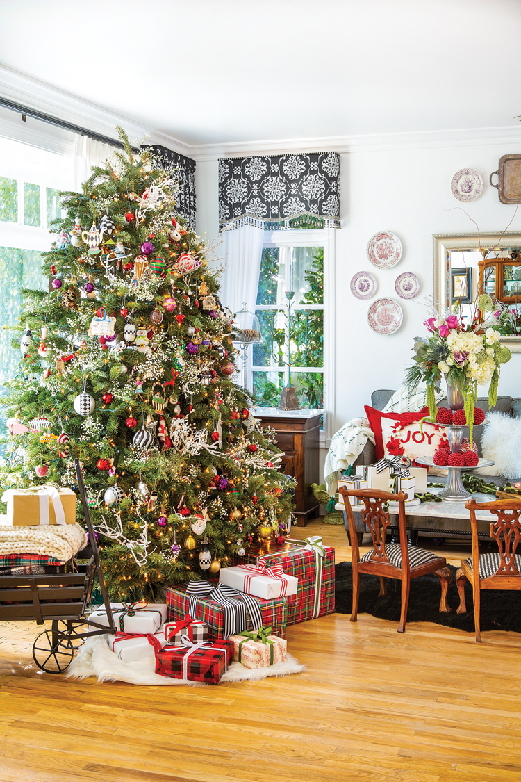 THE FAMILY’S CHRISTMAS TREE, placed in the front window every year, hosts an eclectic decades-old collection of handmade ornaments.