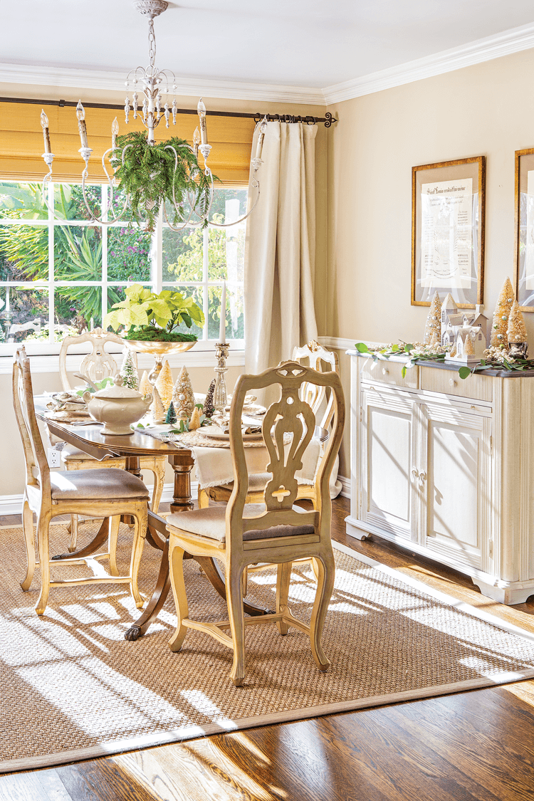 Dining room with neutral color palette and natural christmas decor