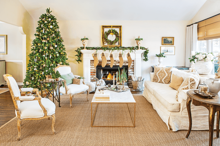 The living room at Maison de Cinq is decorated with neutral and natural Christmas decor