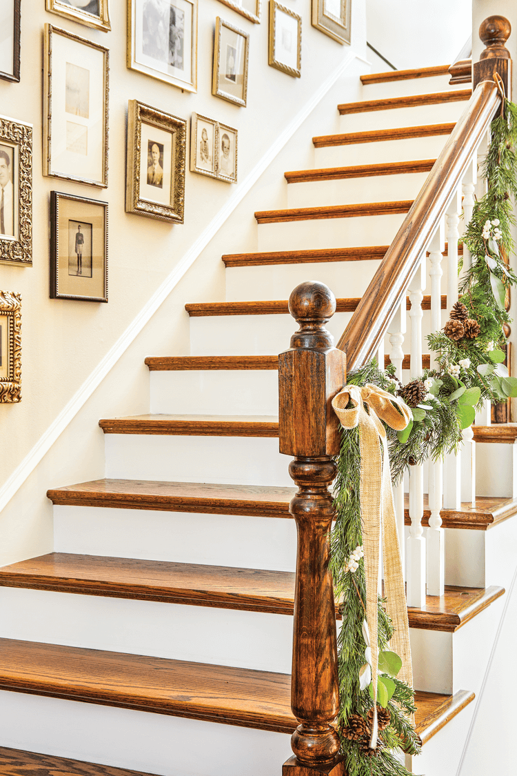 A garland of natural greenery adorns the banister at Maison de Cinq.