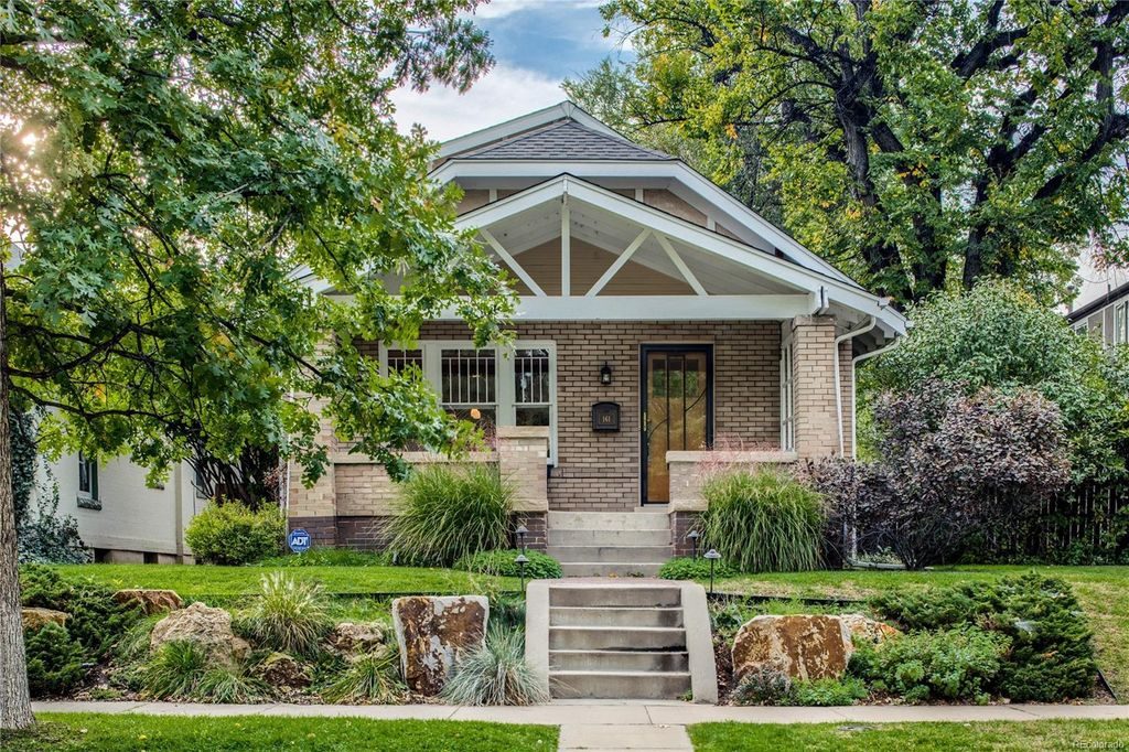 Quaint Denver cottage with an amazing porch and roofline.