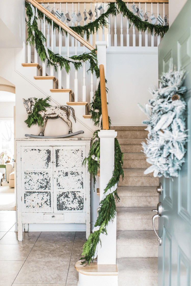 Fresh greenery in the form of natural garlands and real wreaths are an essential part of Miss Mustard Seed's Christmas decor.