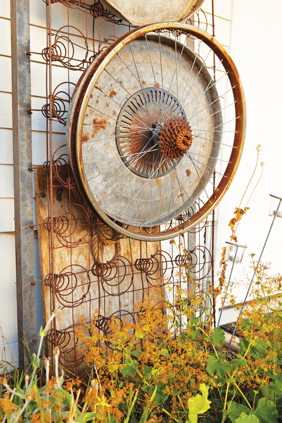 bicycle wheel and bed springs upcycled in the garden