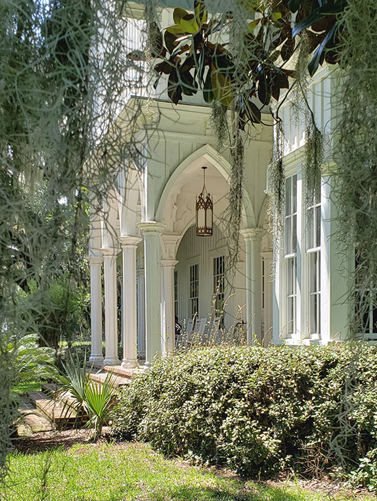 gothic arches and porch framed by spanish moss