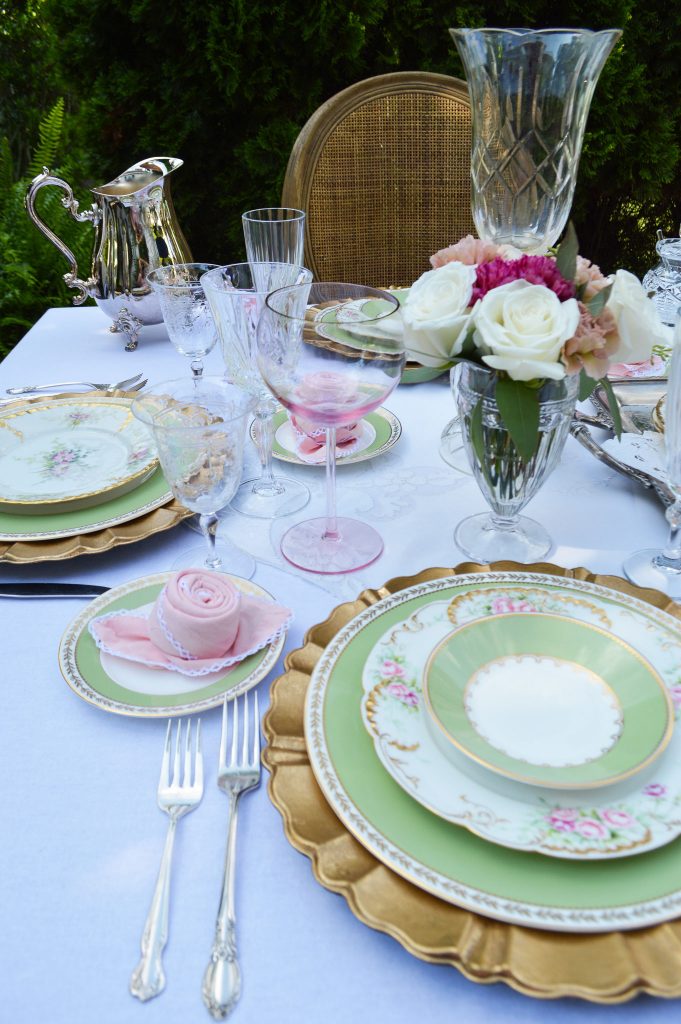 romantic table setting with limoge, crystal and gold chargers