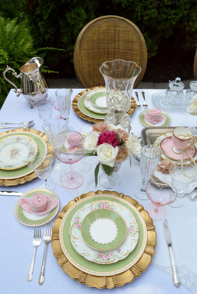 romantic table setting with limoge, crystal and gold.