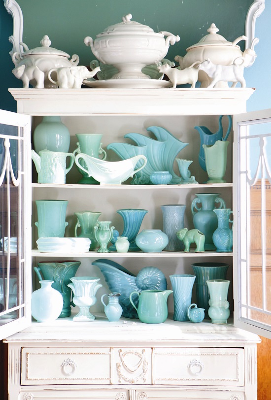 blue vintage pottery in a white china cabinet // collecting by color