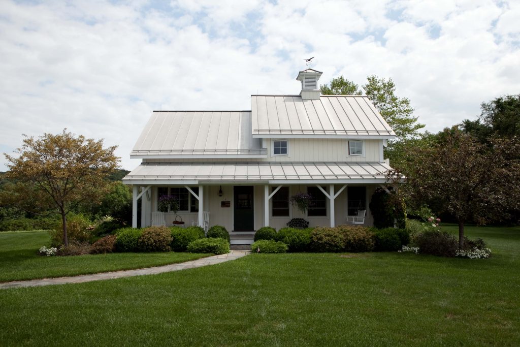 The 2019 Project House will tout a farmhouse roof and porch much like this past project built by Yankee Barn Home.