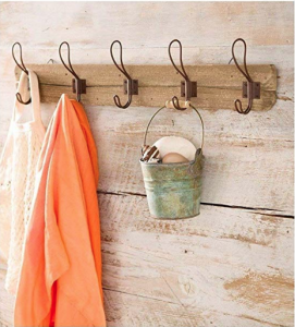 farmhouse style hooks on a wooden mount