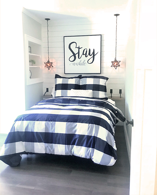 tiny guest room with plaid bedding