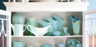 turquoise pottery in a white china cabinet