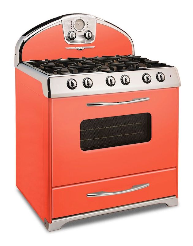 A retro stove range in a bright coral color.