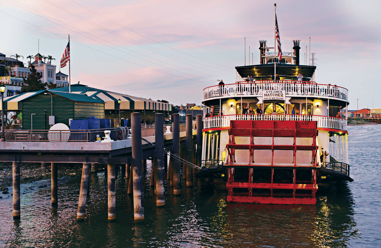 Steamboat in Louisiana, boarding at a dock.