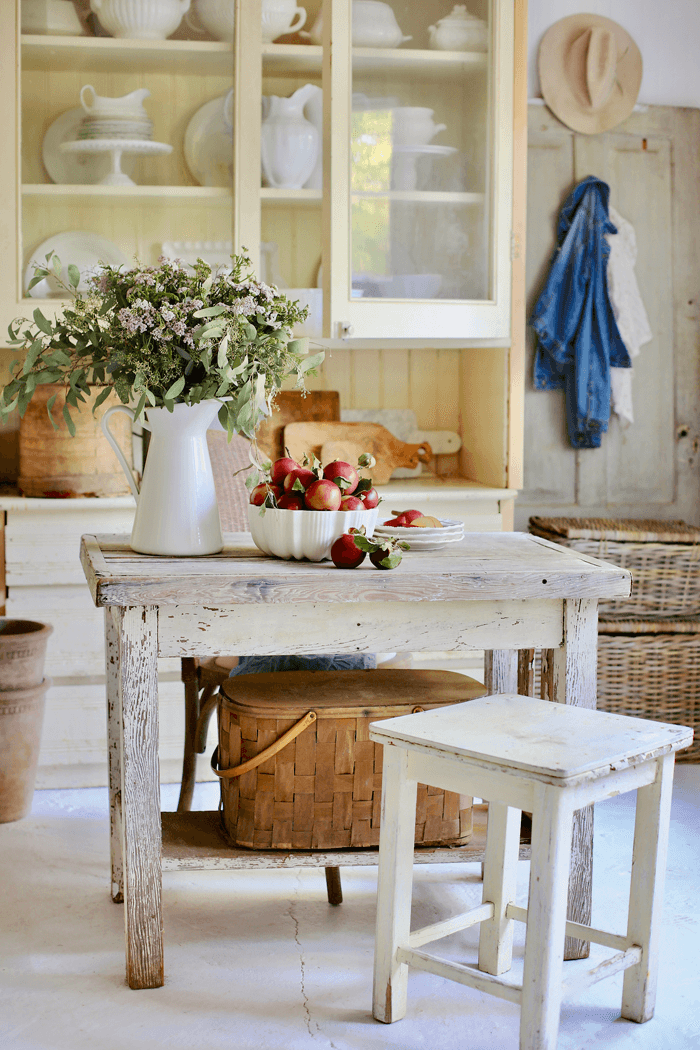 kitchen nook with chippy farm table and bench. 
