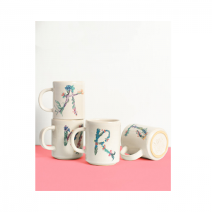 Stack of Monogram Mugs on White and Pink Backdrop