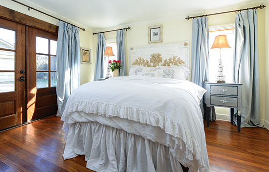 romantic white bedding in a bedroom