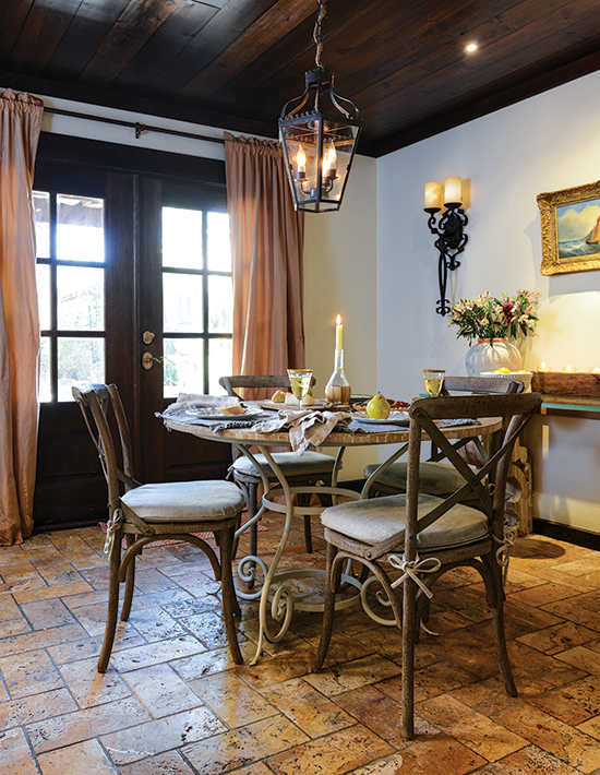 dining room with stone floor and bistro chairs