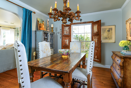 dining room with wooden chandelier