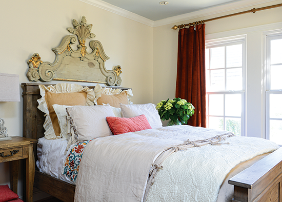 architectural salvage headboard in a tudor cottage bedroom