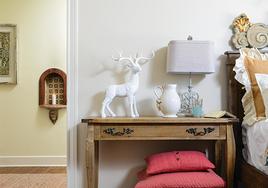 white ceramic buck on a nightstand