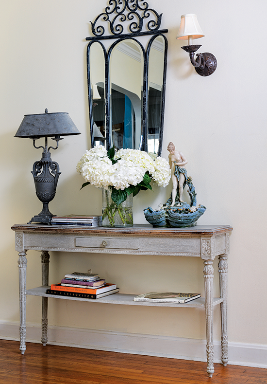 antique sideboard with wrought iron mirror