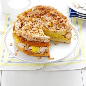 A layered torte with cake, meringue, and custard.