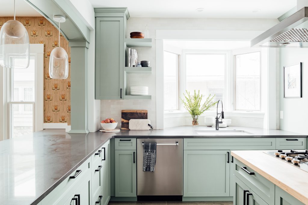 renovated craftsman kitchen with blue cabinets