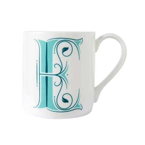 White mug with ornate, teal, monogram letter E